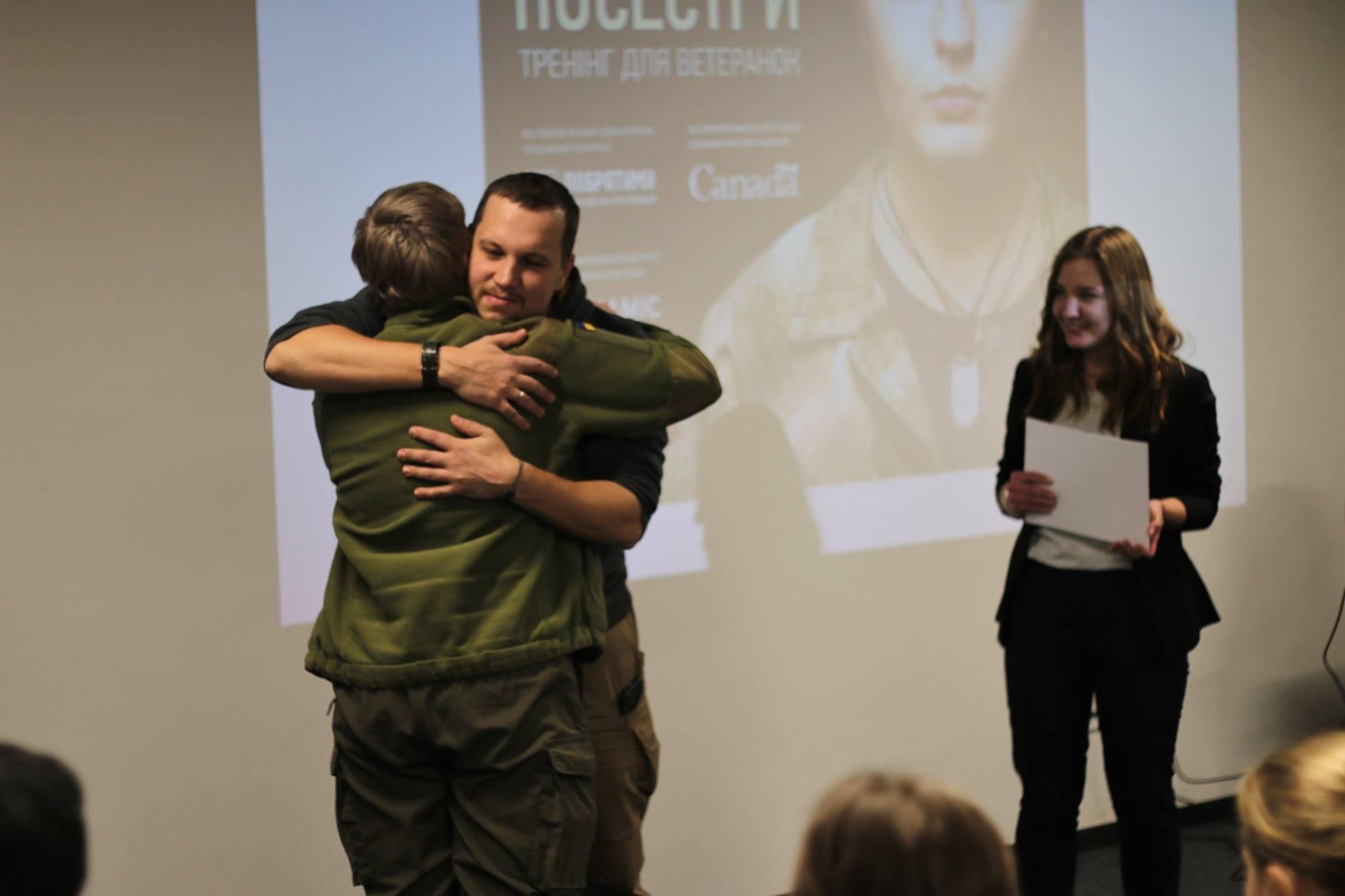 Veterans embracing at a Bodynamic training session in Ukraine